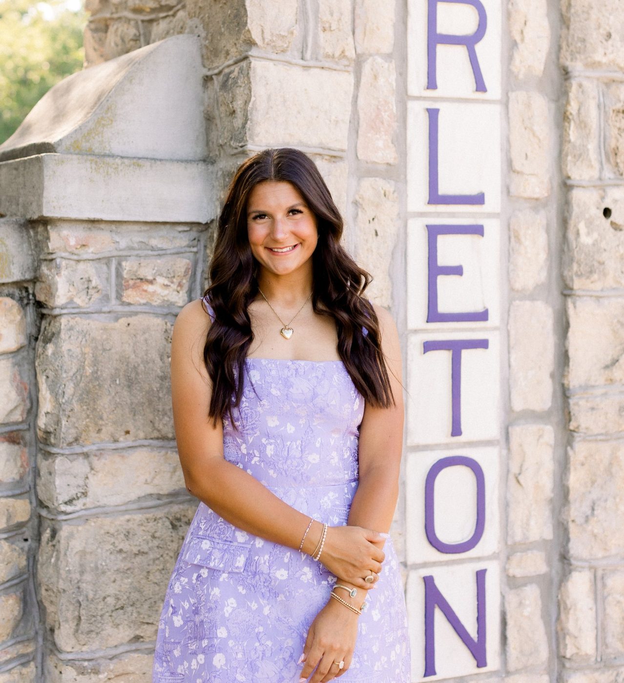Molly standing beside the Tarleton stone gate